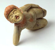 Reclining female figure. Central America, Mexico, possibly Puebla. Early Formative period (1200-900 BC). h. 7.0 x w. 11.0 x d. 7.5 cm. UEA 786